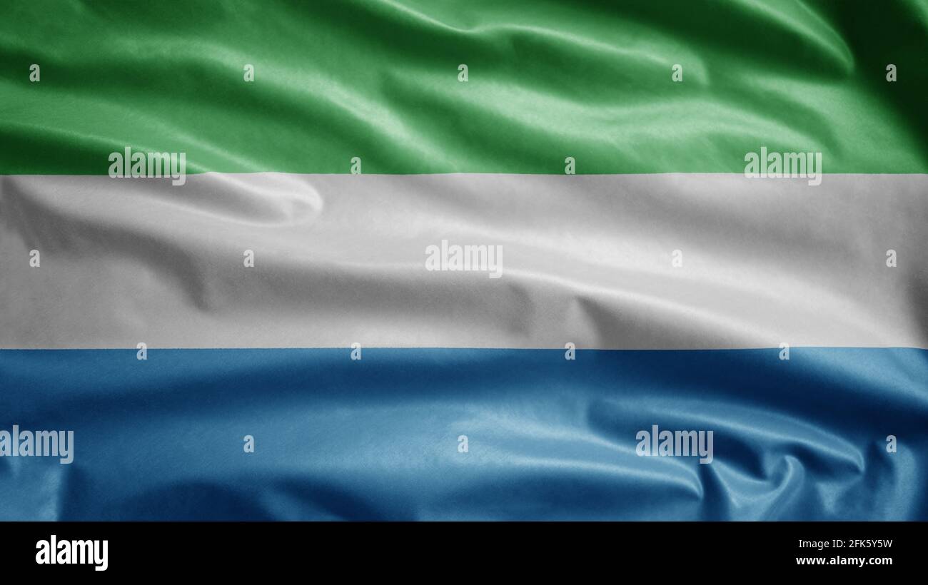 Sierra Leone flag waving in the wind. Close up of Salone banner blowing ...