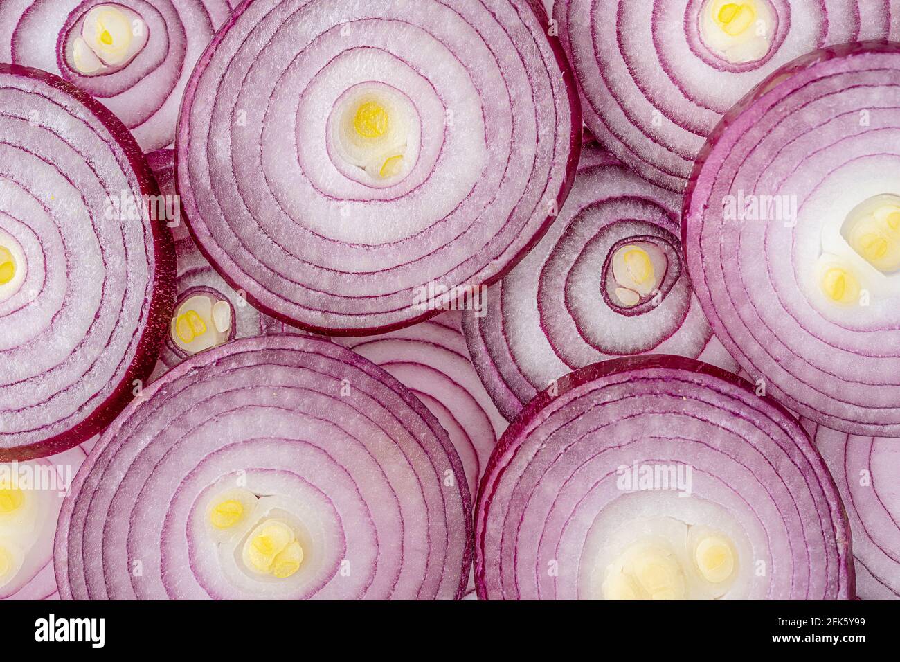 Sliced red onions texture. Food background, directly above Stock Photo