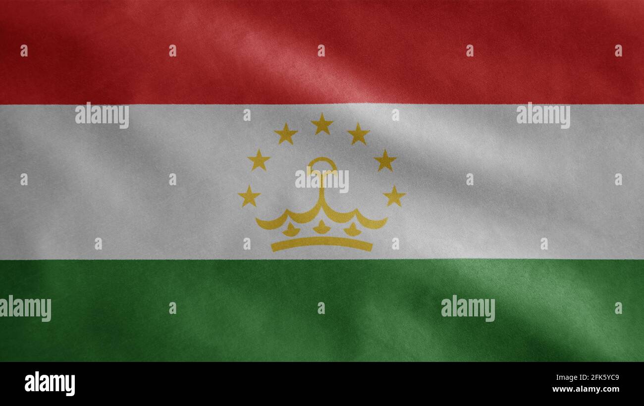 Tajikistani flag waving in the wind. Close up of Tajikistan banner blowing, soft and smooth silk. Cloth fabric texture ensign background. Stock Photo