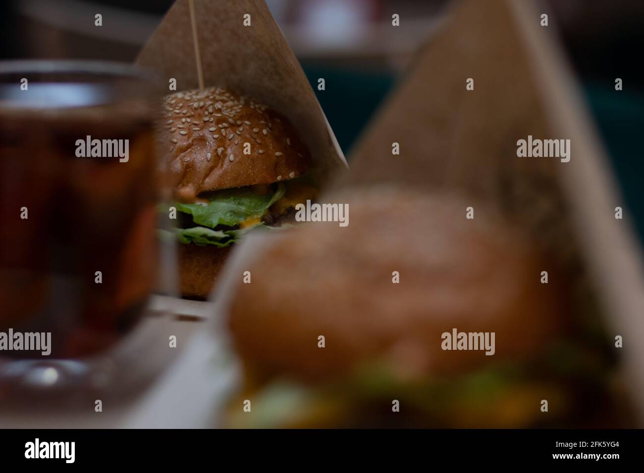 Burger with cheese, beef patty and salad. Selective Sharpness Stock Photo