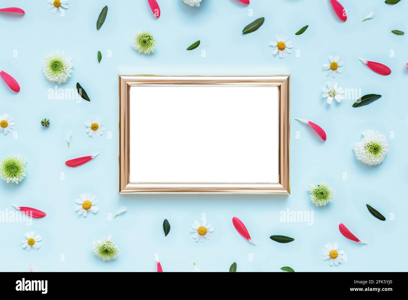 Golden photo frame mockup on flowers pattern background Stock Photo