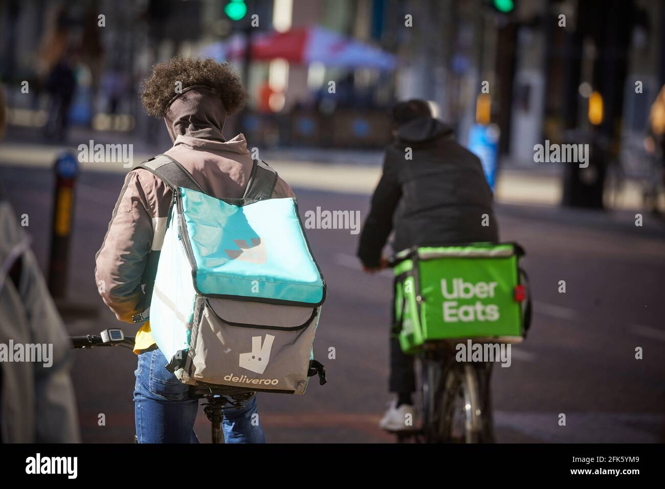 bike rider cycle courier Deliveroo online food delivery company Stock Photo