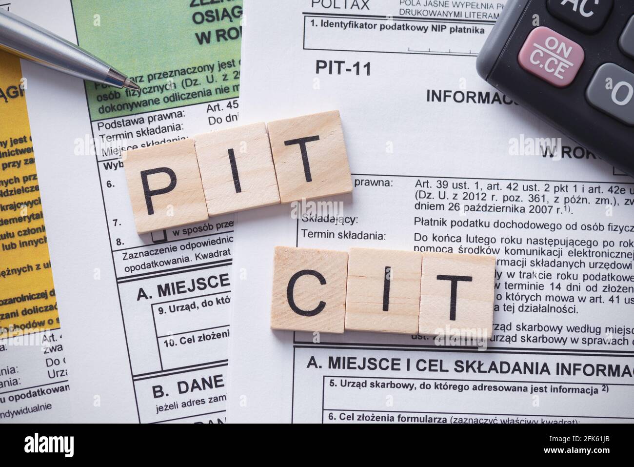 Tax income concept with polish tax forms and PIT, CIT words from tiles,  means personal and company tax income in Poland Stock Photo - Alamy