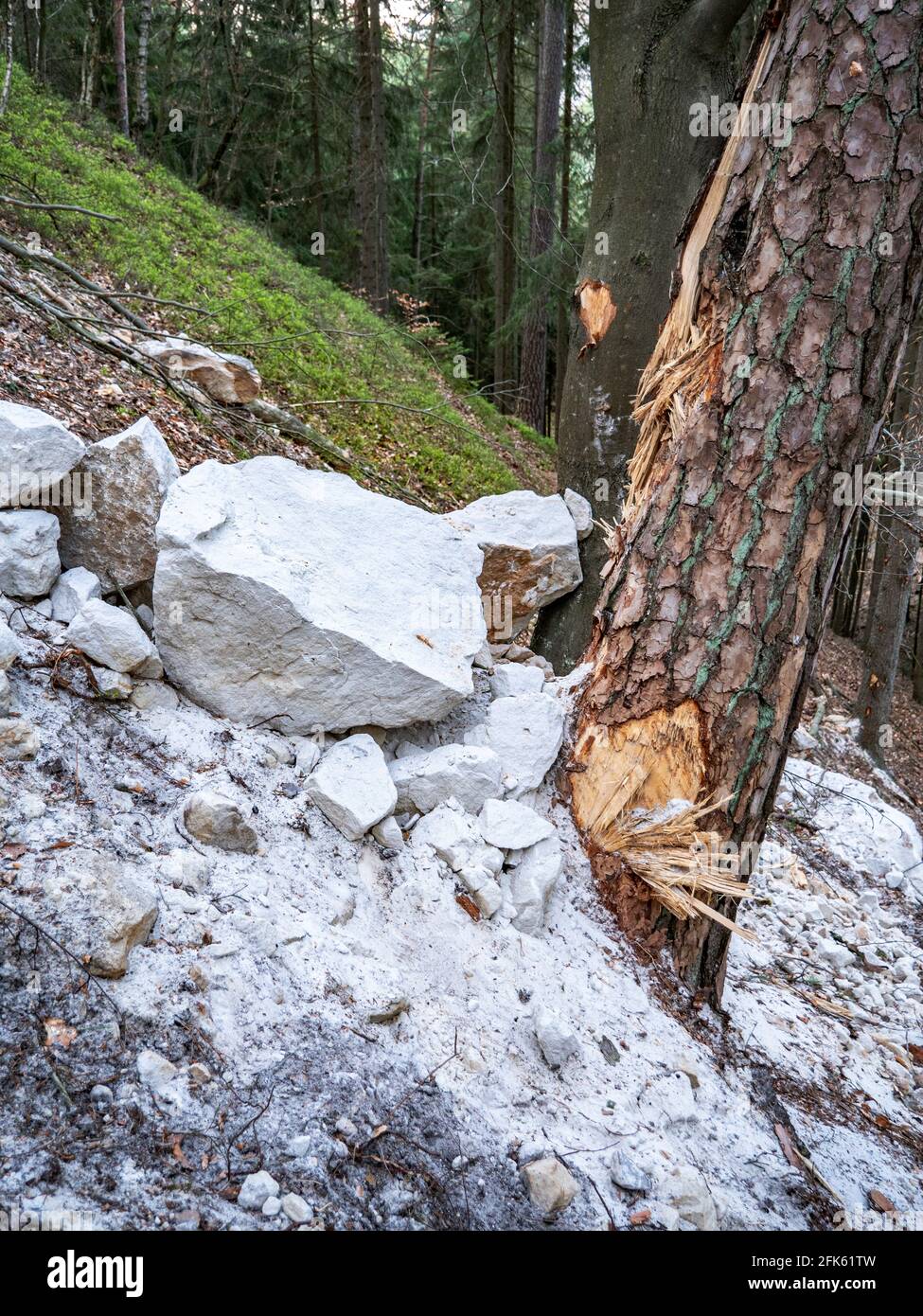 Collapsed rocky boulders fall down from sandstone rocks and landslide ...