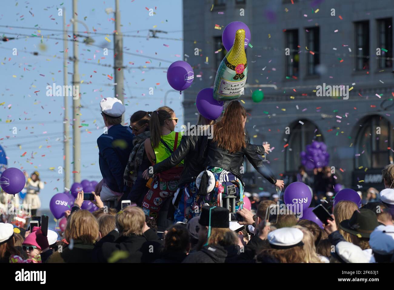 Helsinki, Finland - April 30, 2019: People celebrating placement of the student cap on statue of Havis Amanda in the center of Helsinki as a highlight Stock Photo