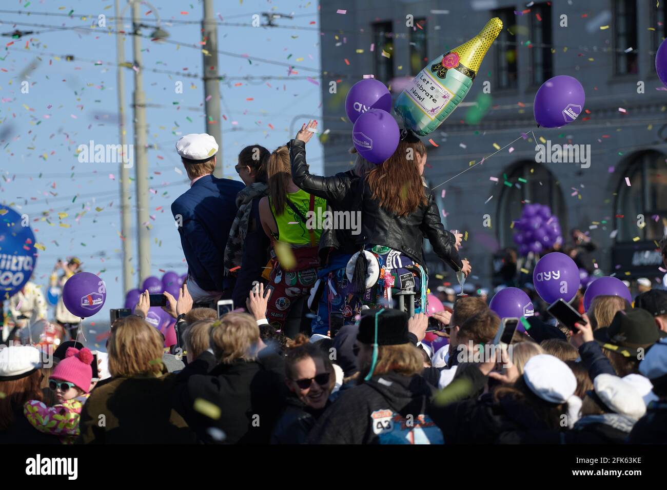 Helsinki, Finland - April 30, 2019: People celebrating placement of the student cap on statue of Havis Amanda in the center of Helsinki as a highlight Stock Photo