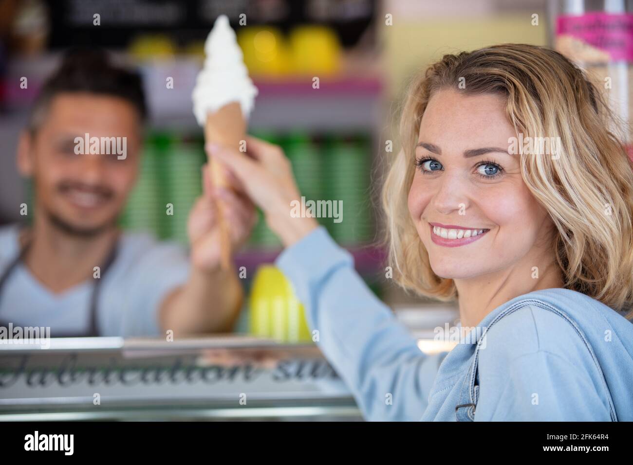 Woman buying ice cream cone hires stock photography and images Alamy