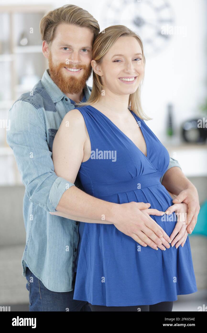 happy man hugging his pregnant wife Stock Photo - Alamy