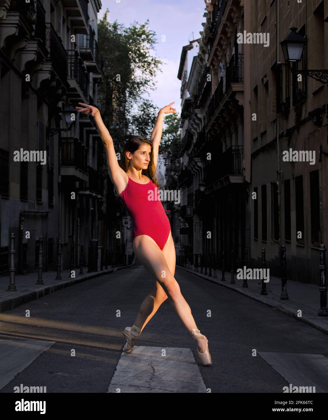 Portrait of a young ballerina on pointe shoes in the street Stock Photo