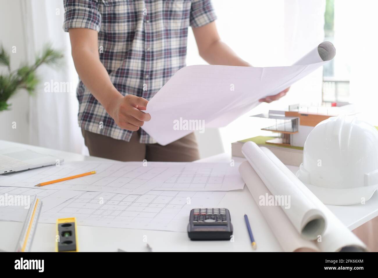 Architect or engineer working in office Stock Photo