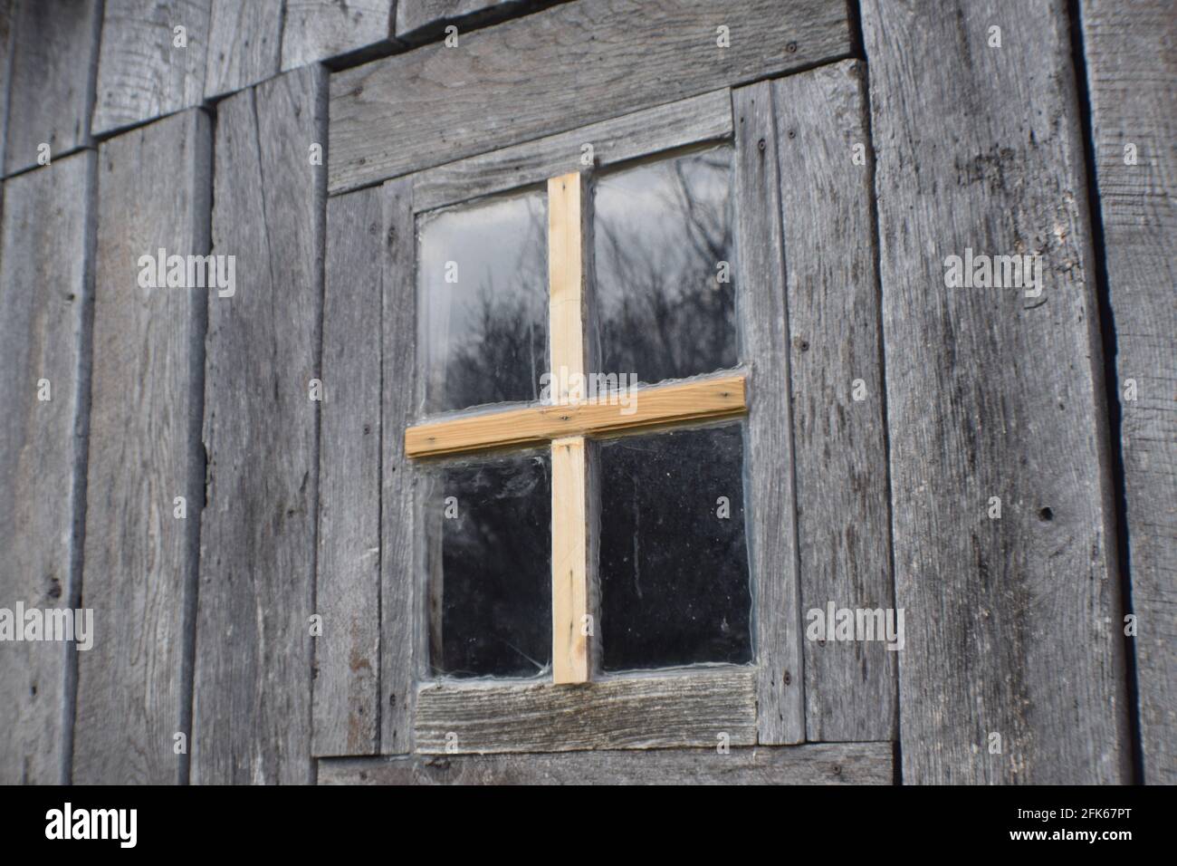 Cross in window Stock Photo