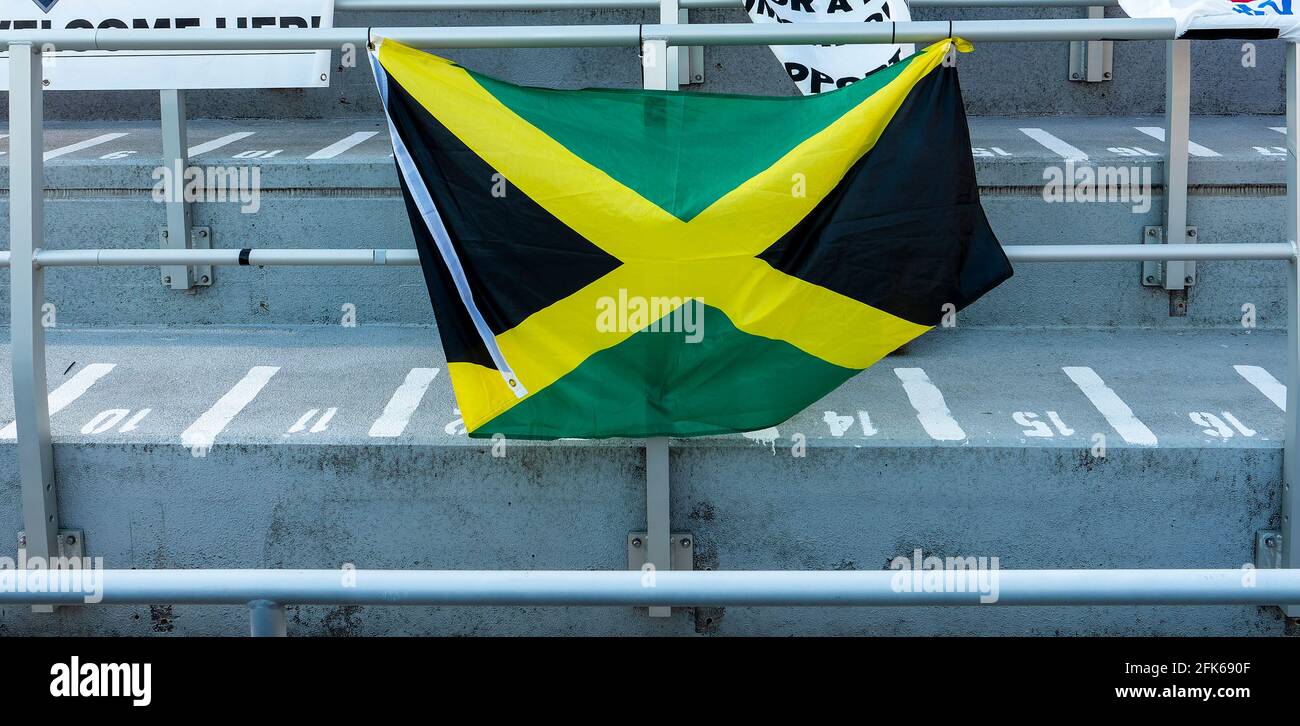 Jamaican flag hanging on a railing in an empty stadium Stock Photo