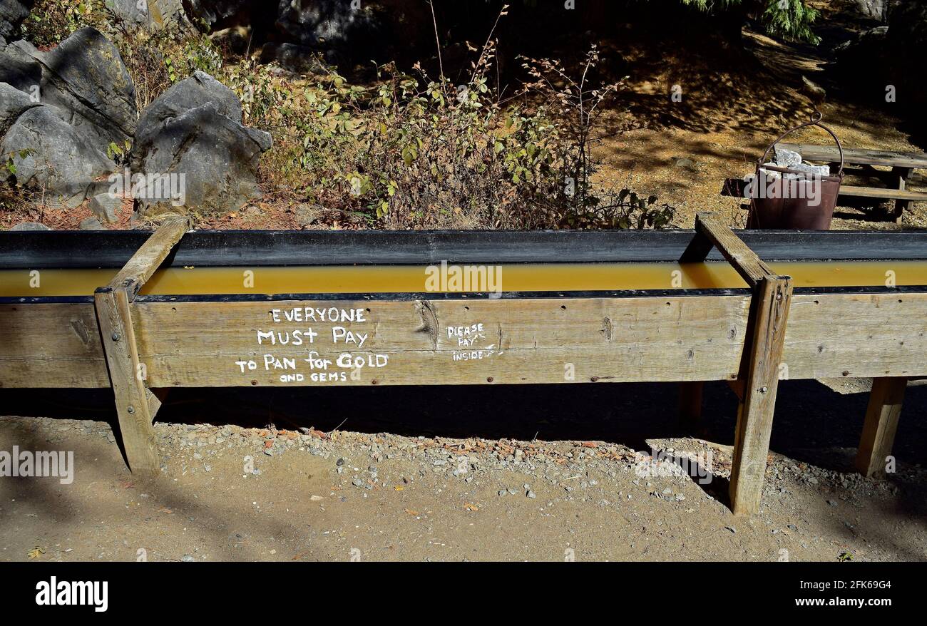 pay to pan for gold in wooden sluice box Columbia State Historic Park, Columbia, California Stock Photo