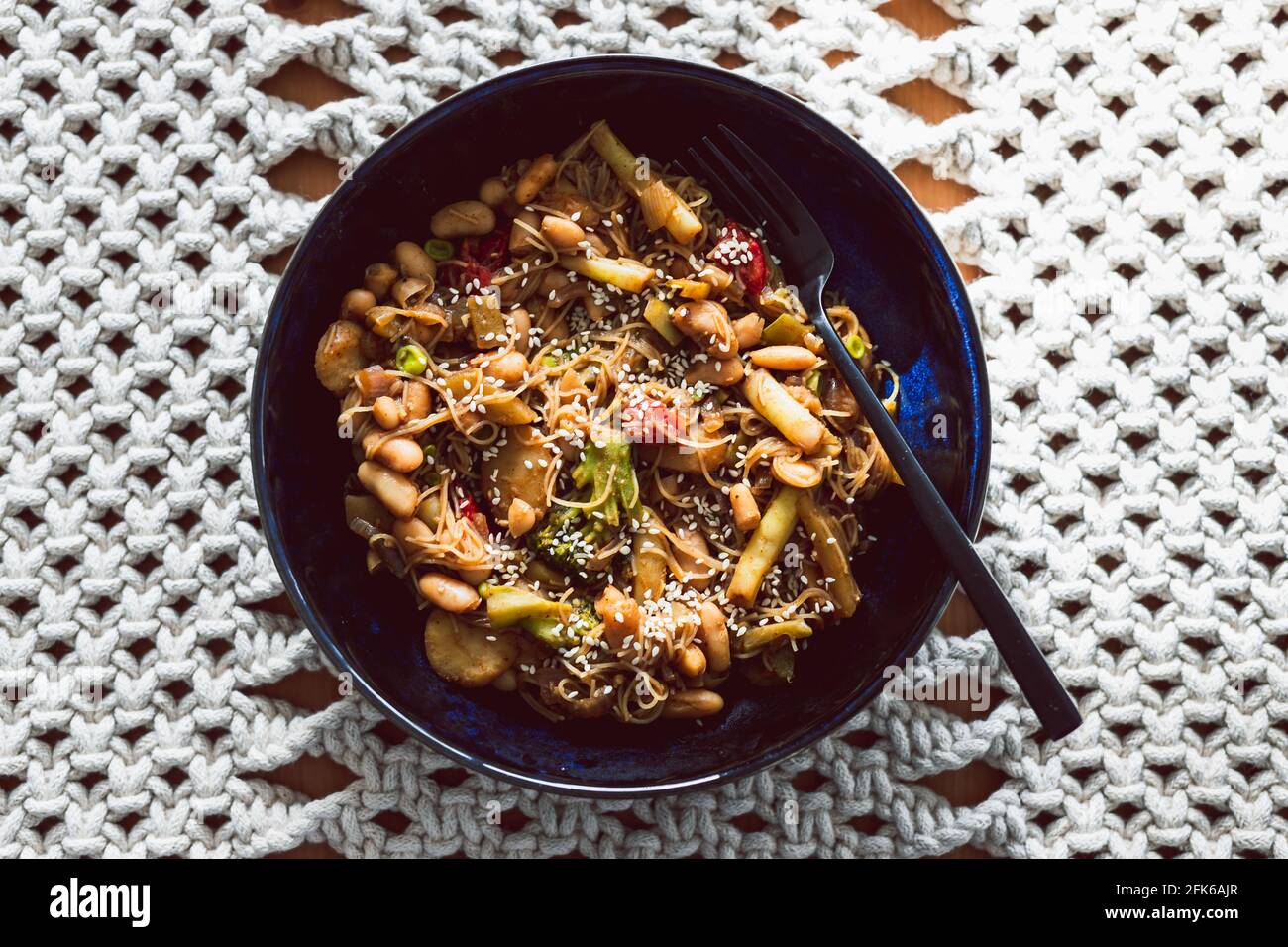 vegan stir fry with mixed vegetables and bamboo shoots topped white