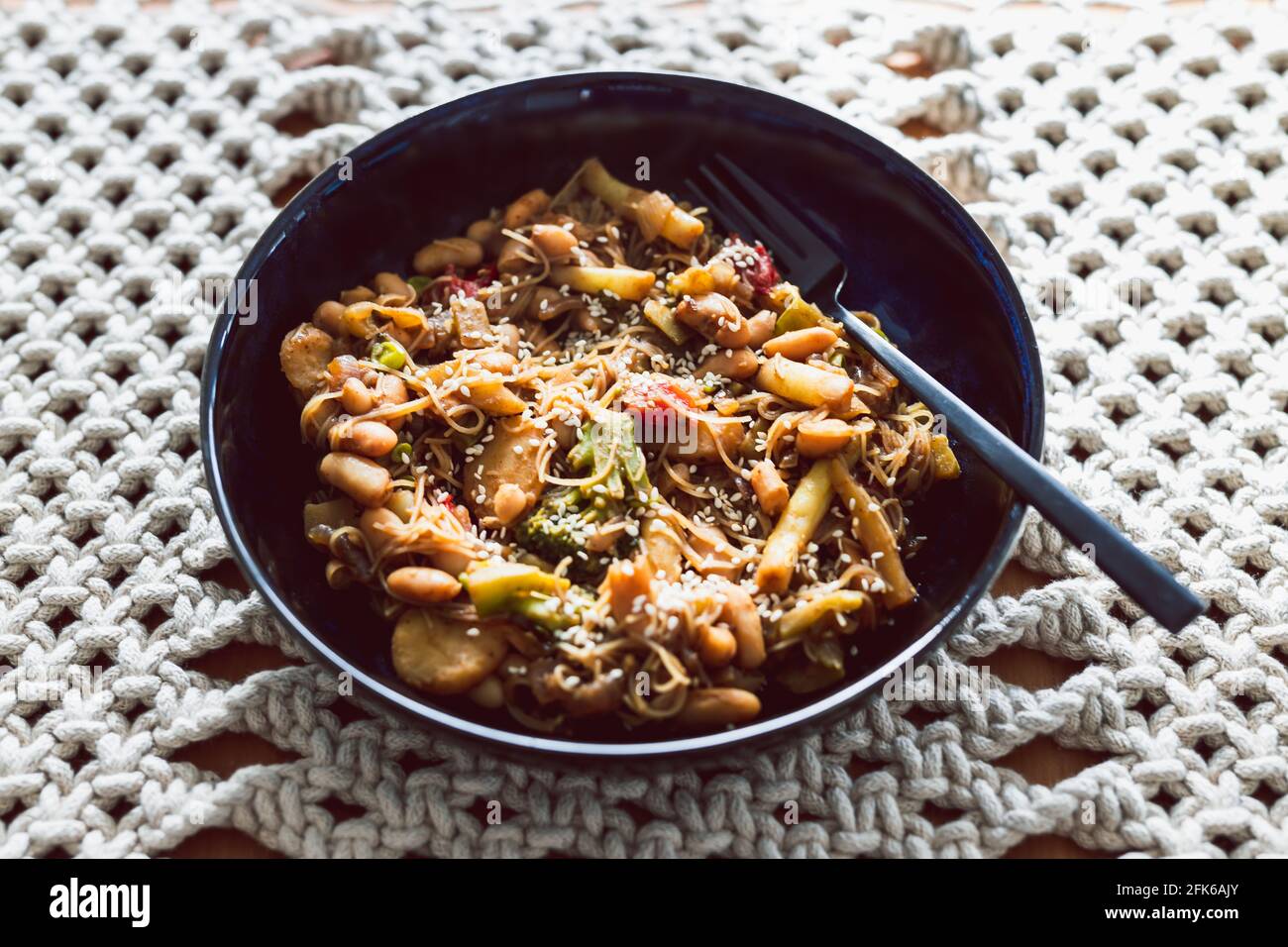 vegan stir fry with mixed vegetables and bamboo shoots topped white