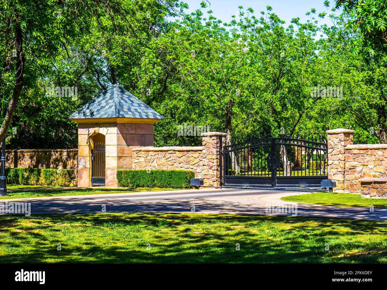 Black Metal Security Gates With Walk Thru Gate House Stock Photo Alamy