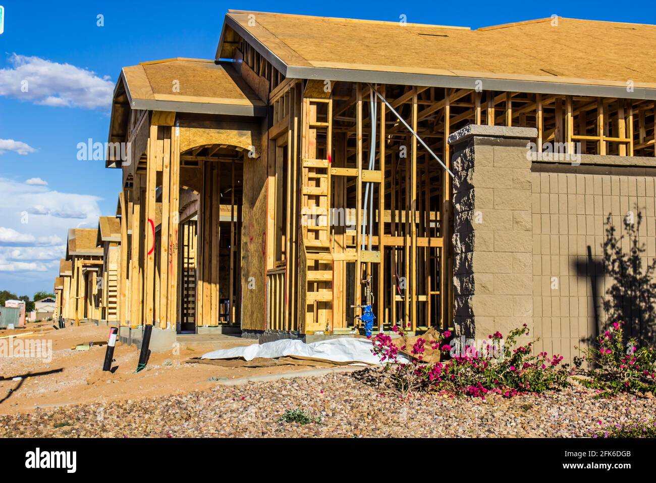 Row Of New Homes Under Construction In Housing Development Stock Photo