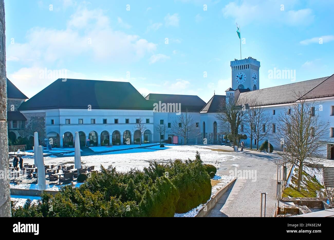The courtyard of historic Ljubljanski Grad (Castle) with parade geounds, historic buildings and the Panoramic Tower in the background, Ljubljana, Slov Stock Photo