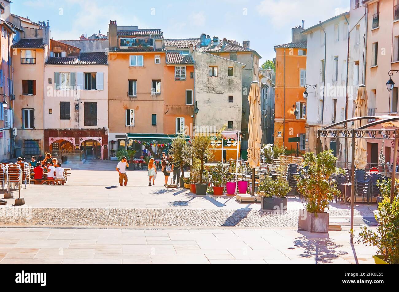 AIX-EN-PROVENCE, FRANCE- MAY 6, 2013: The old dense housing in Forum des Cardeurs Square with cozy bars, cafes and outdoor restaurants, on May 6 in Ai Stock Photo