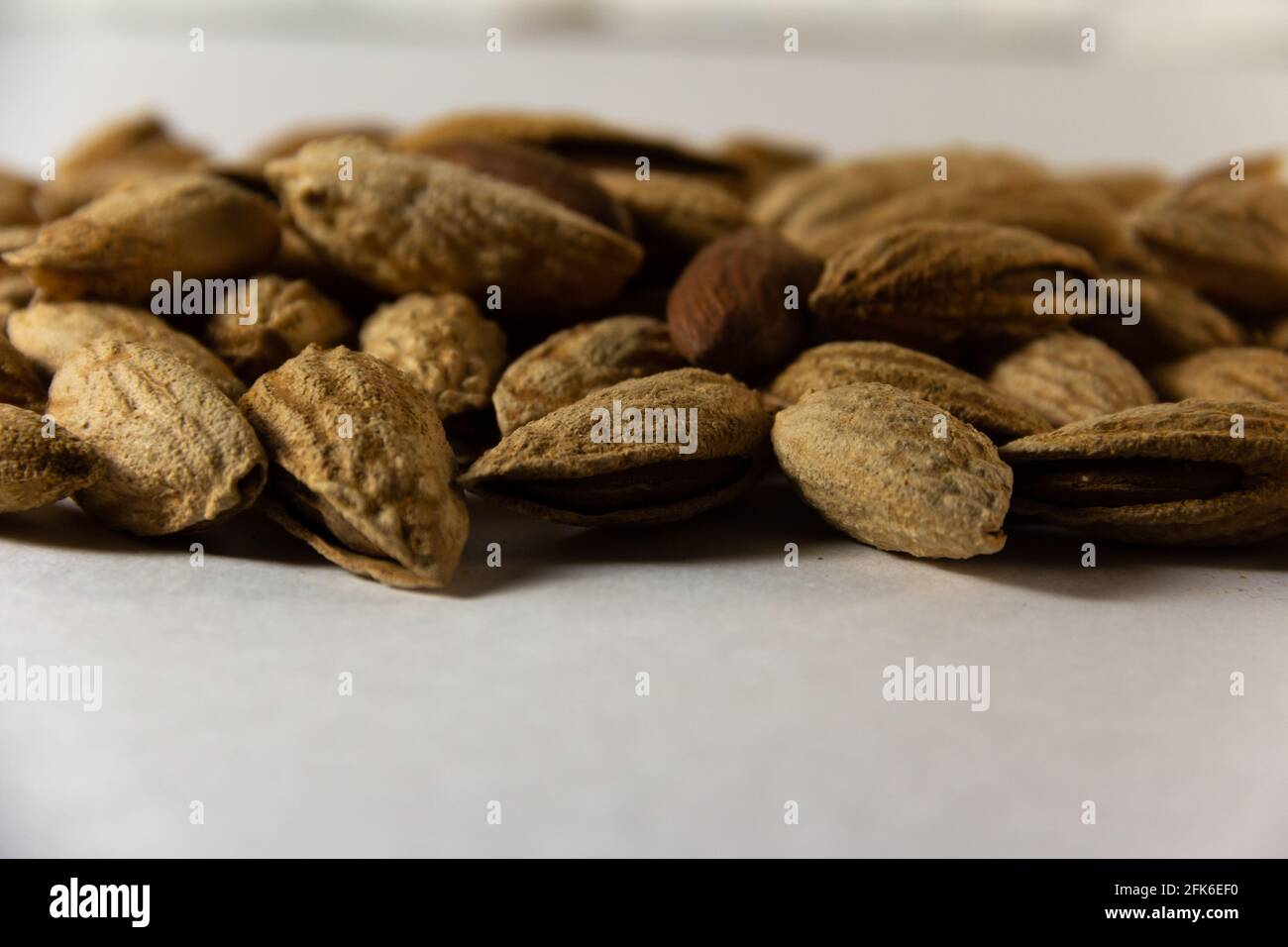 Almond nuts in a shell close-up Stock Photo - Alamy