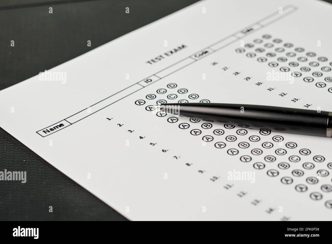 Closeup of a black pen on an exam test's answer sheet Stock Photo Alamy