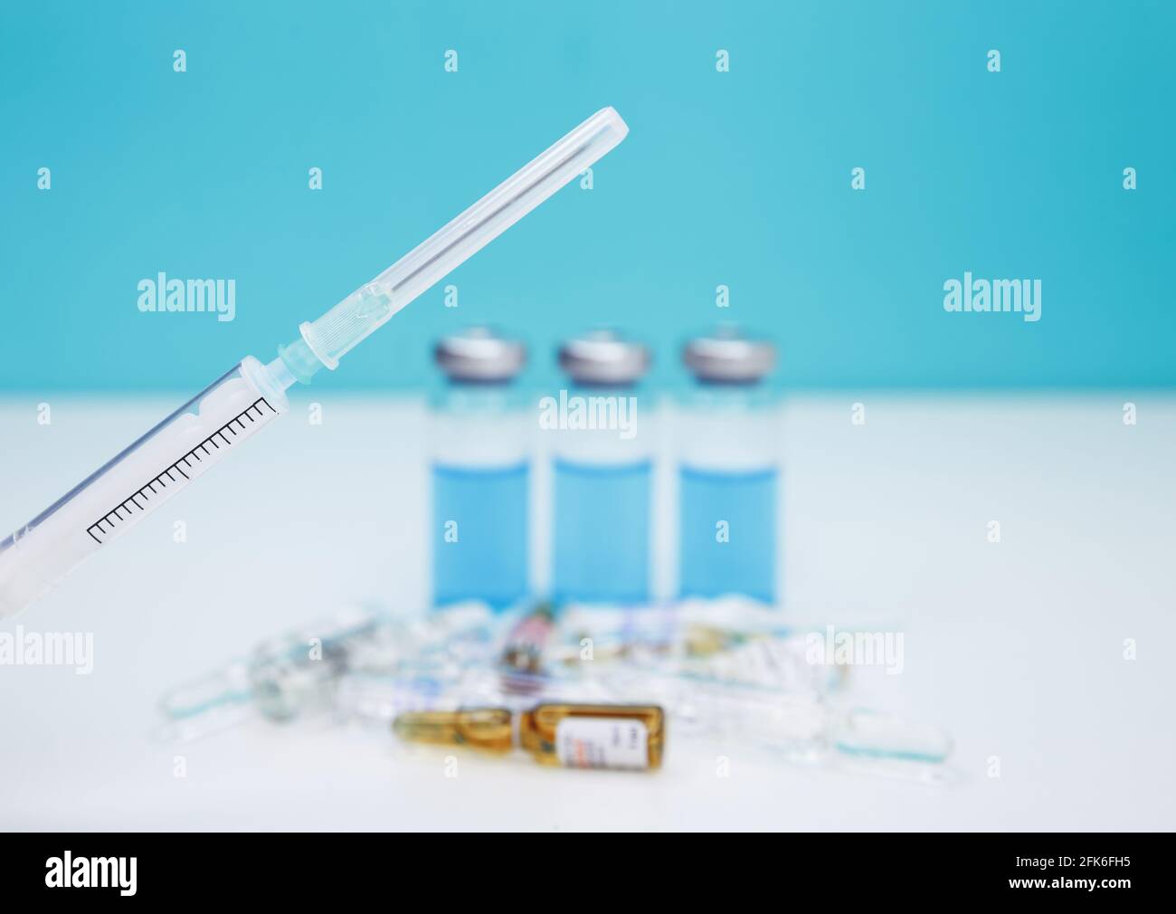Monochromatic image of glass vials and a syringe. Medical syringe Stock ...