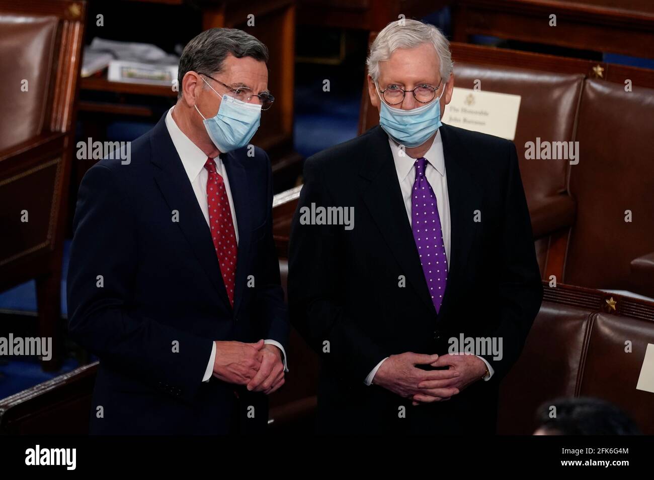 United States Senator John Barrasso (Republican of Wyoming), and US Senate Minority Leader Mitch McConnell (Republican of Kentucky) of Ky., stand after President Joe Biden spoke to a joint session of Congress Wednesday, April 28, 2021, in the House Chamber at the U.S. Capitol in Washington. Credit: Andrew Harnik/Pool via CNP | usage worldwide Stock Photo