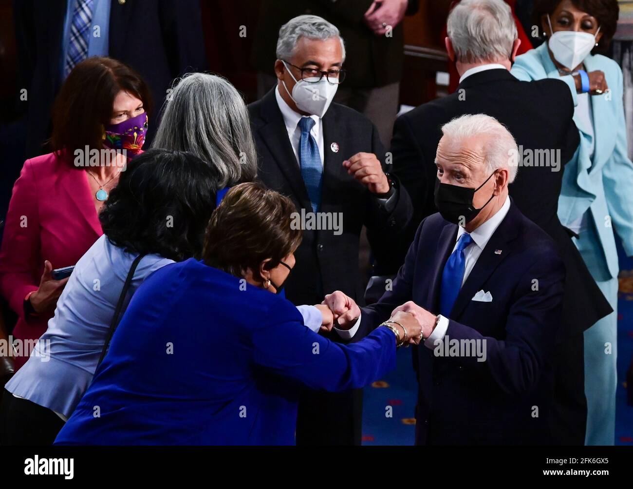 Washington, United States. 28th Apr, 2021. President Joe Biden is greeted by members of the United States House of Representatives after delivering his first joint address to a session of Congress at the U.S. Capitol in Washington DC, on Wednesday, April 28, 2021. Pool photo by Jim Watson/UPI Credit: UPI/Alamy Live News Stock Photo