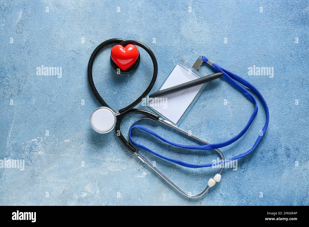 Modern stethoscope with heart and blank badge on color background Stock ...