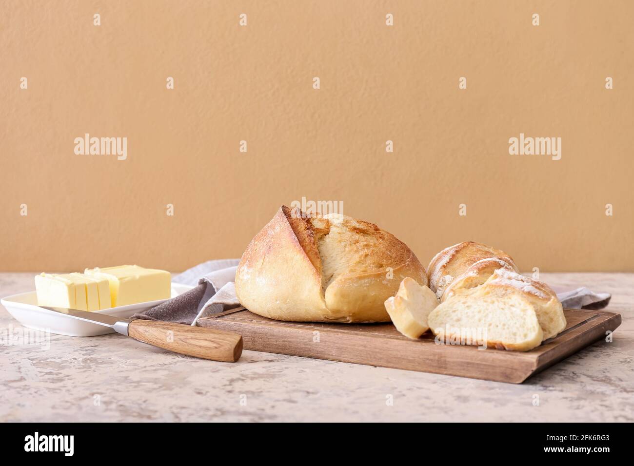 Board with fresh cut bread on grunge background Stock Photo - Alamy