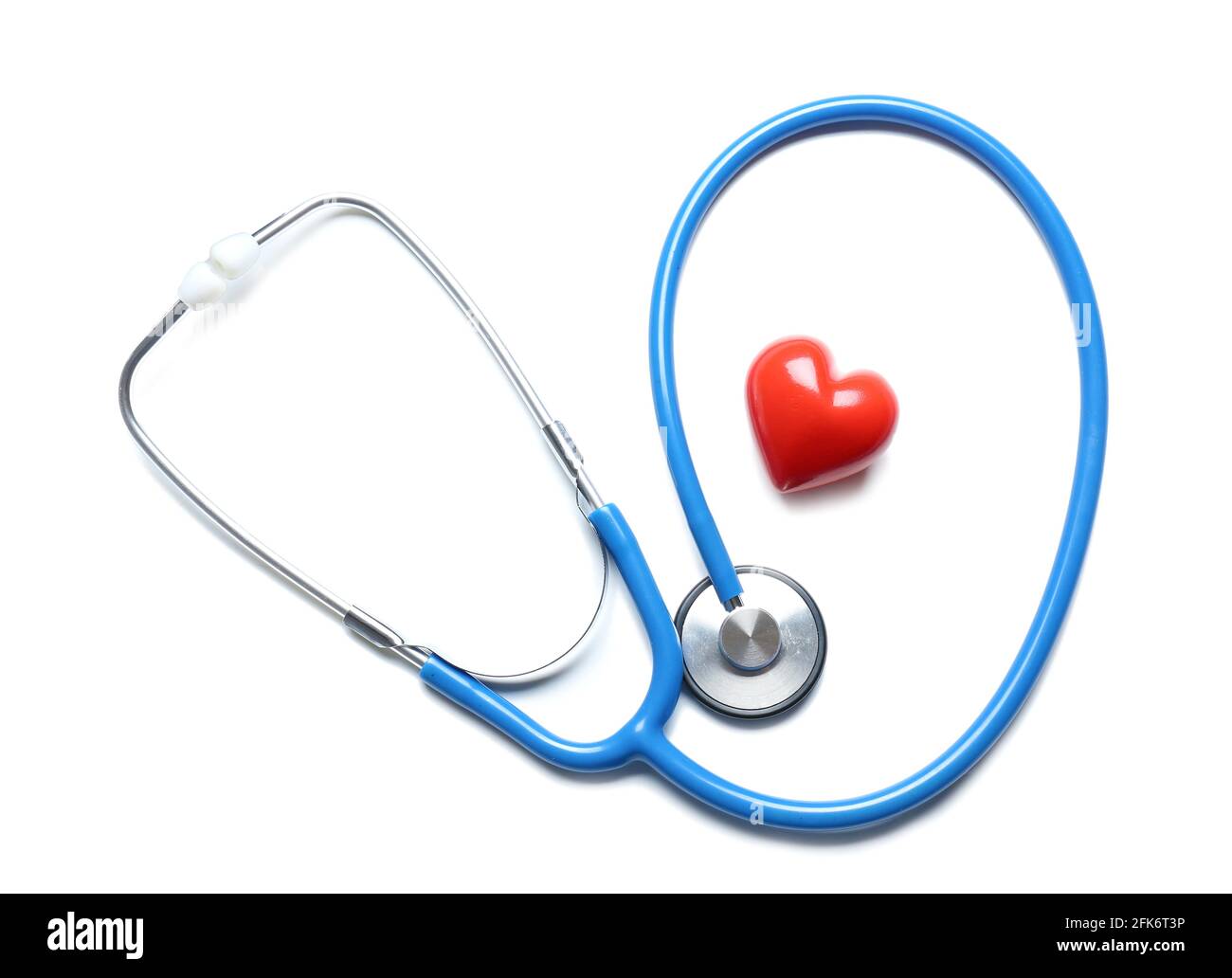 Modern stethoscope and red heart on white background Stock Photo - Alamy