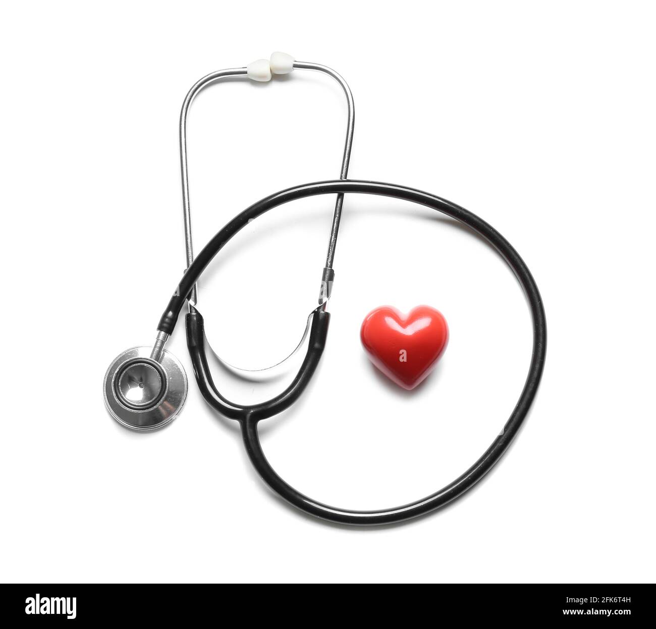 Modern stethoscope and red heart on white background Stock Photo - Alamy