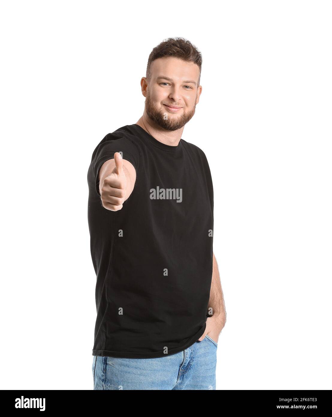 Handsome man showing thumb-up on white background Stock Photo - Alamy