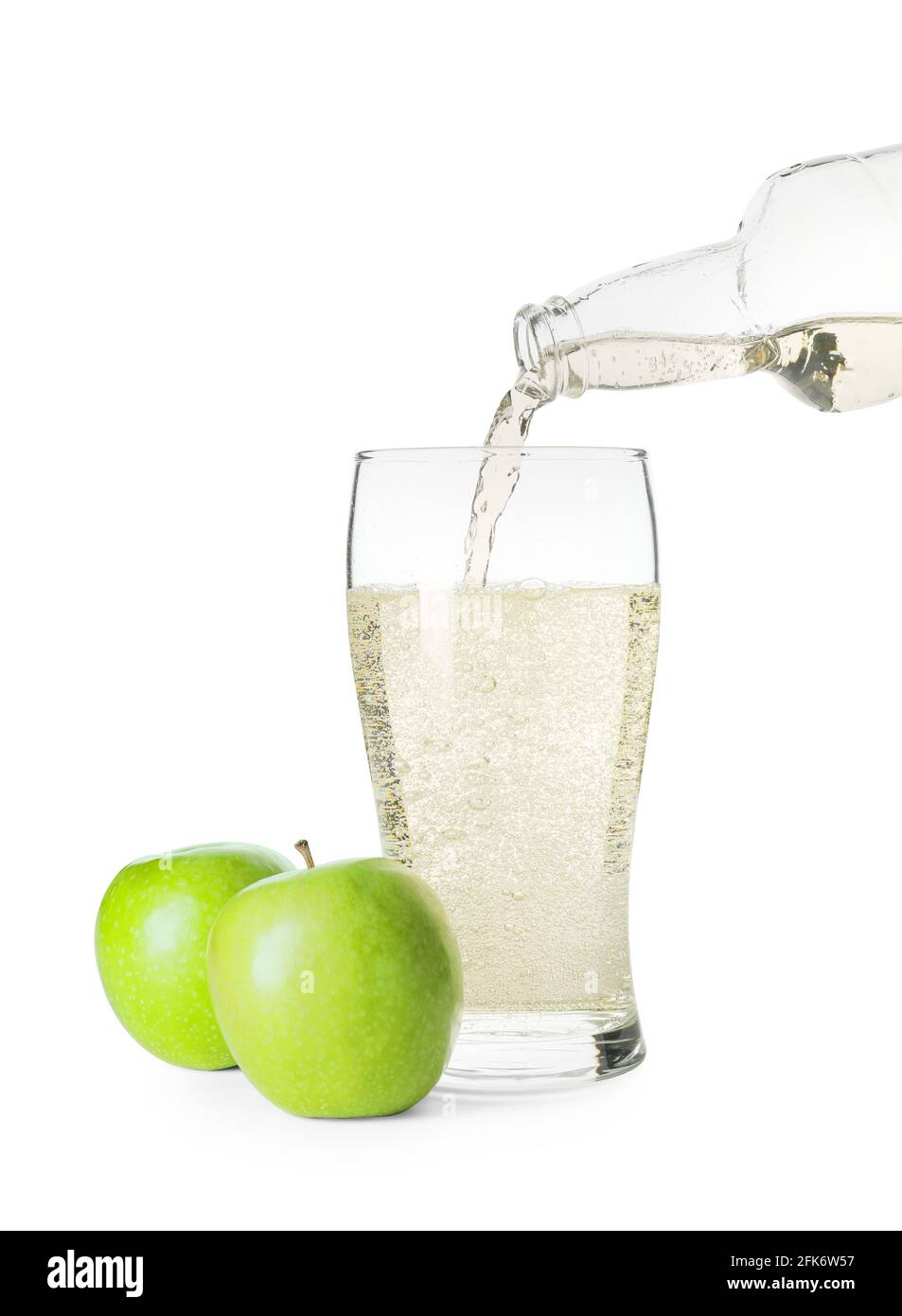 Pouring of apple cider into glass on white background Stock Photo Alamy