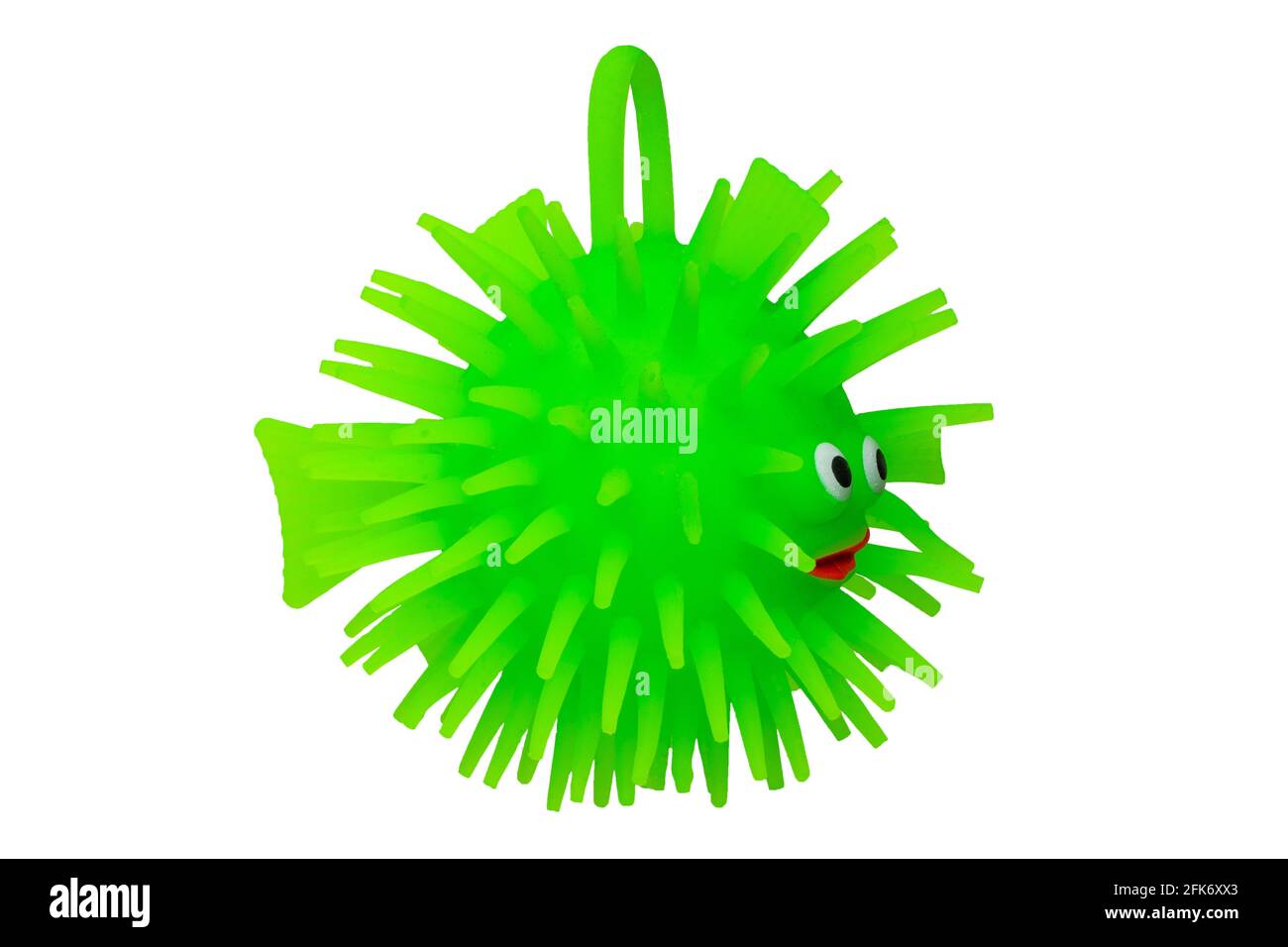 Rubber toys. Funny green puffer fish made of rubber. Cute toy fish isolated on a white background. Macro. Stock Photo