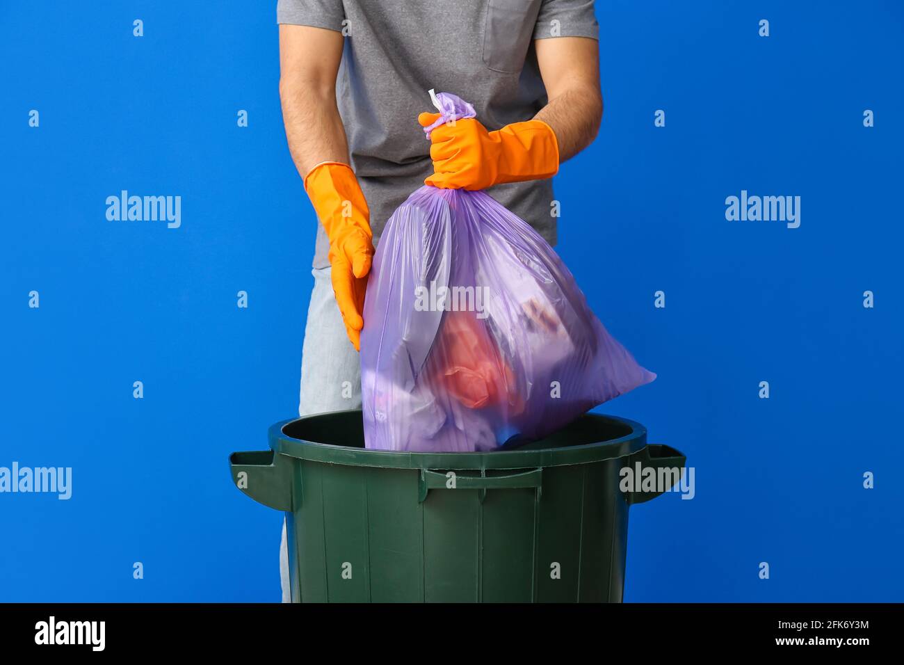 Man Throwing Rubbish In Bin High Resolution Stock Photography and