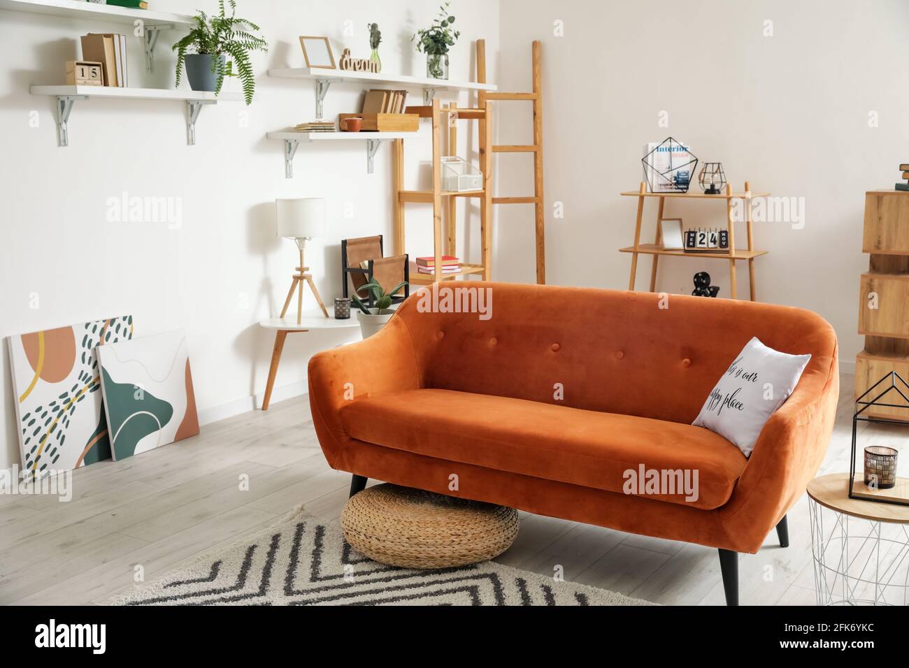 Stylish interior of living room with comfortable sofa Stock Photo - Alamy