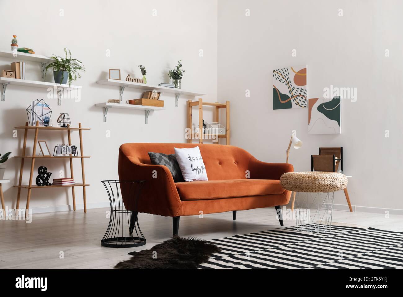 Stylish interior of living room with comfortable sofa Stock Photo - Alamy
