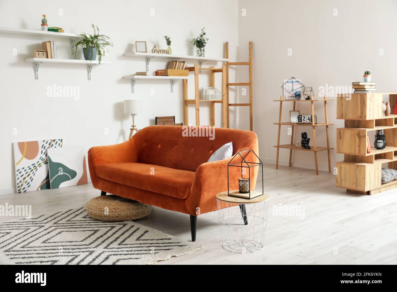 Stylish interior of living room with comfortable sofa Stock Photo - Alamy
