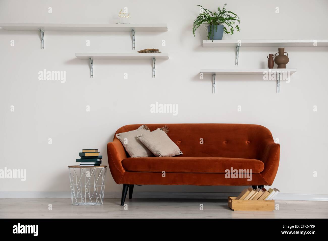 Stylish interior of living room with comfortable sofa Stock Photo - Alamy