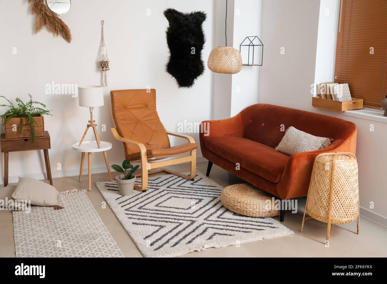 Stylish interior of living room with comfortable sofa Stock Photo - Alamy