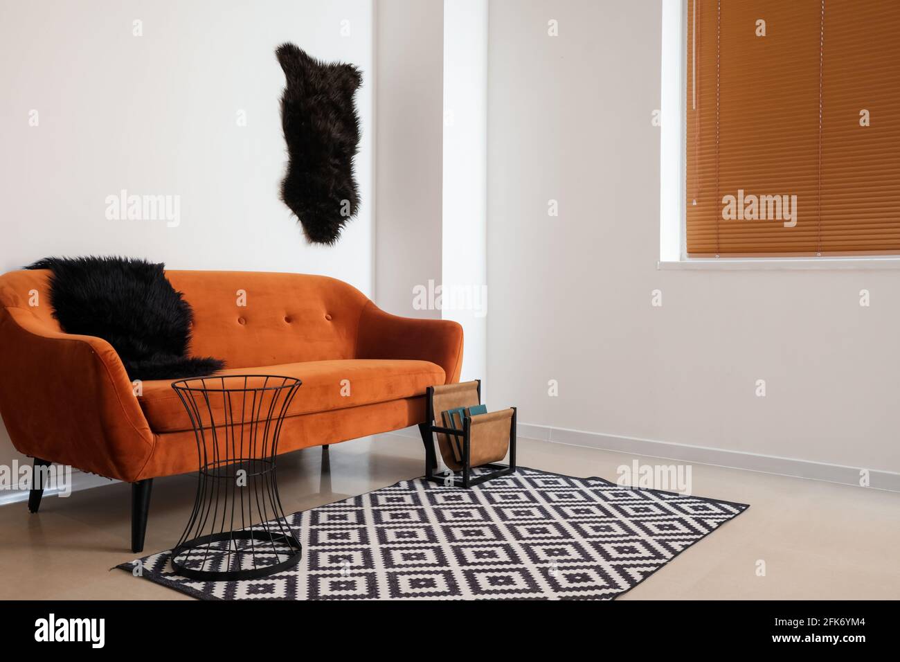 Stylish interior of living room with comfortable sofa Stock Photo - Alamy