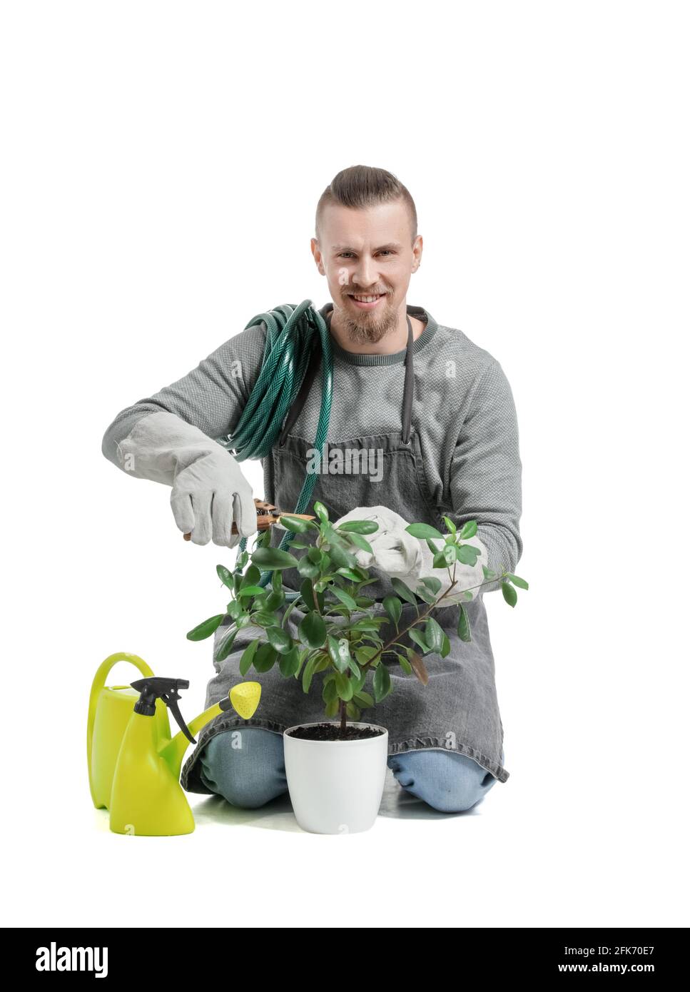 Young male gardener on white background Stock Photo - Alamy