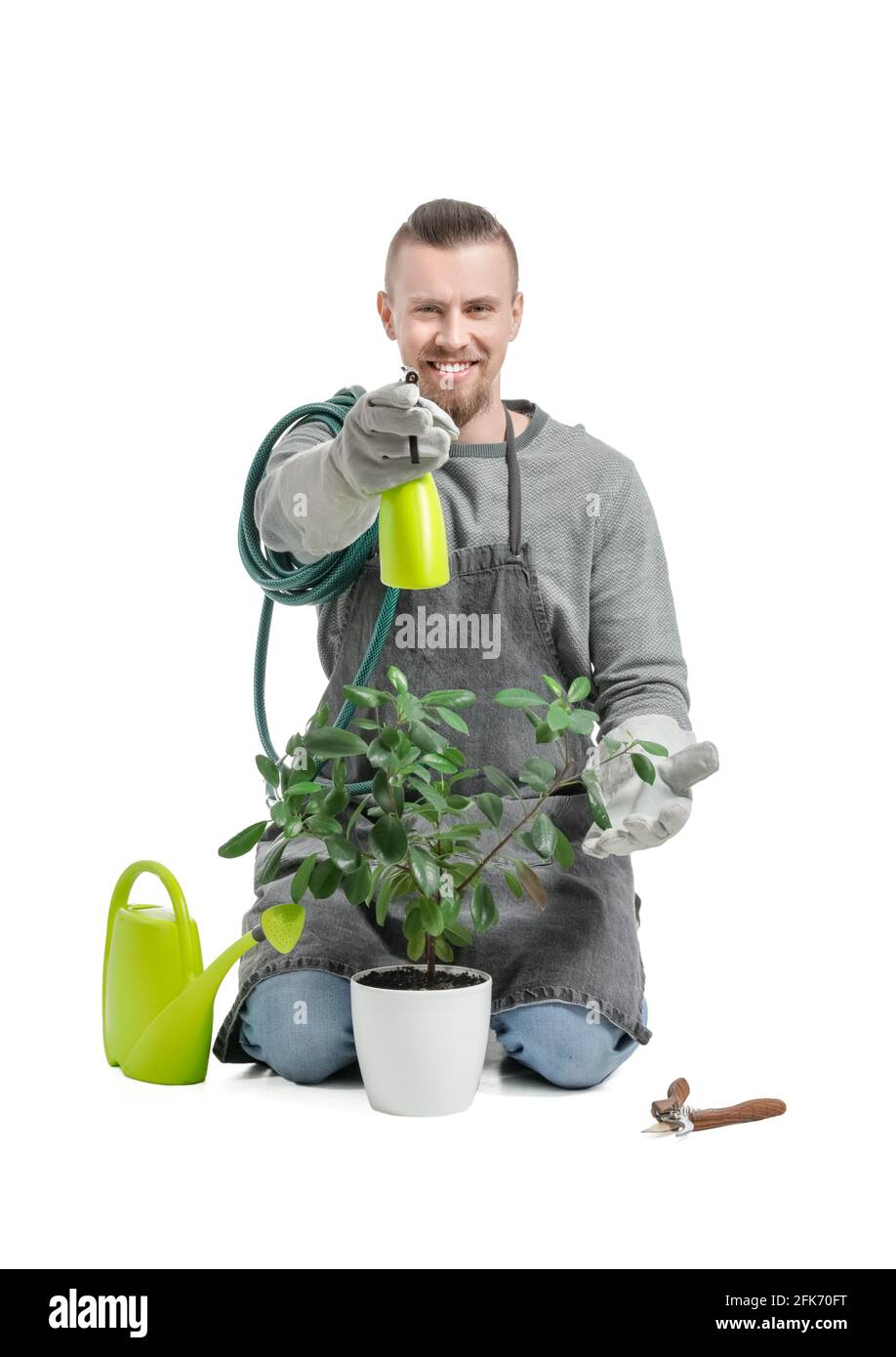 Young male gardener on white background Stock Photo - Alamy