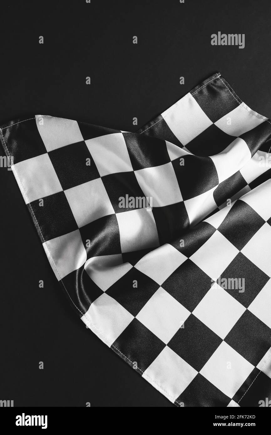Racing flag on dark background Stock Photo - Alamy