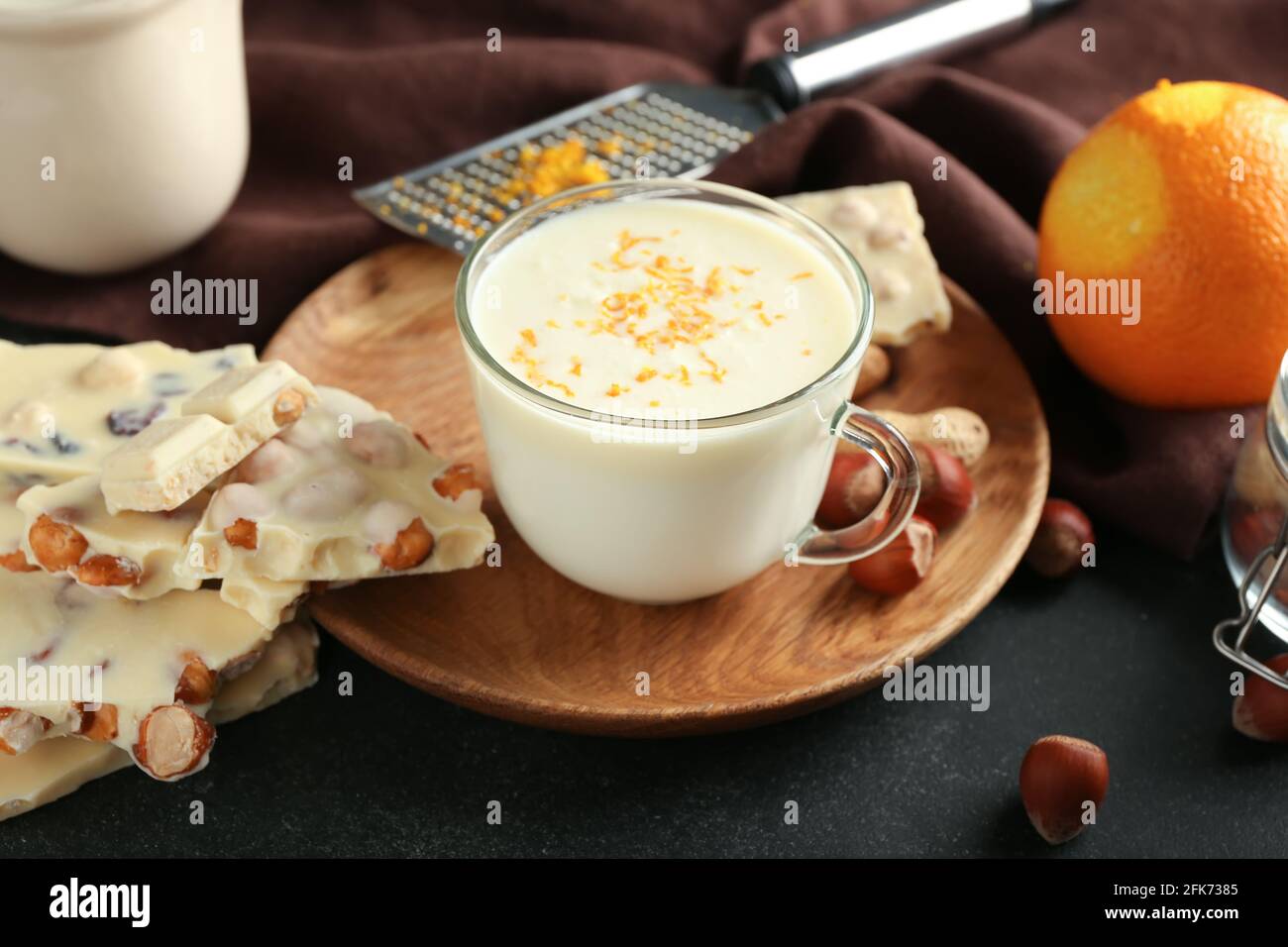 Cup with hot white chocolate on dark background Stock Photo