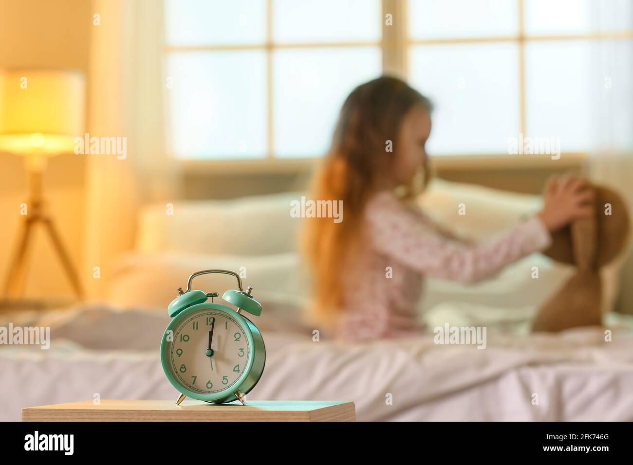 Alarm clock in bedroom of little girl Stock Photo Alamy