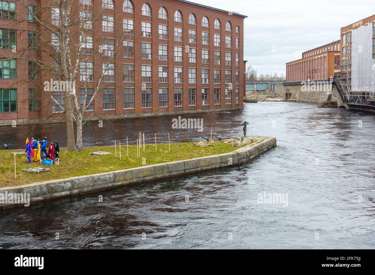 Old Tampella and Finlayson industrial buildings by the water in Tampere Finland Stock Photo