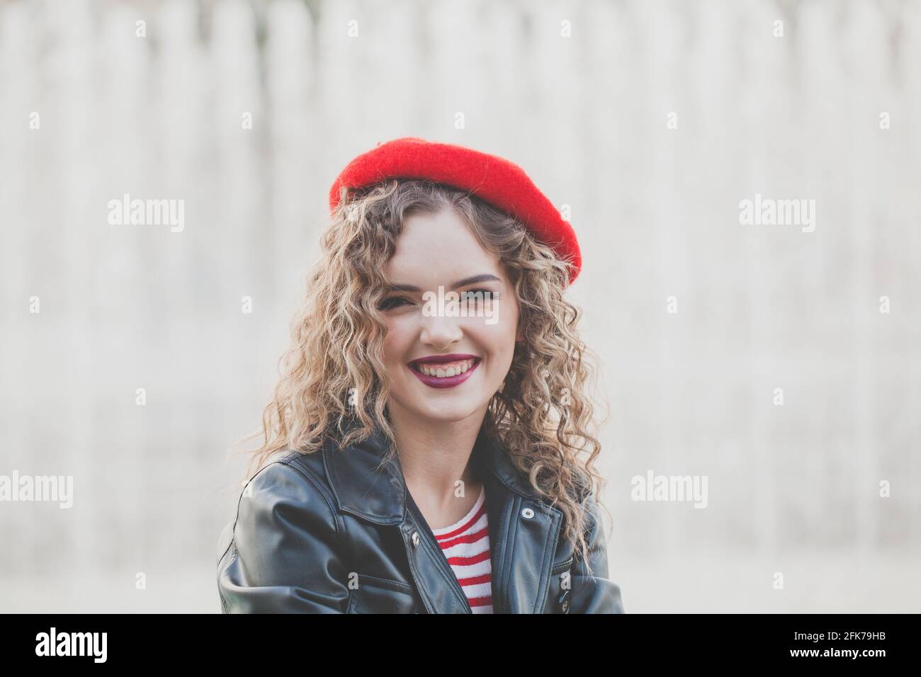 Curly woman in beret hi-res stock photography and images - Alamy
