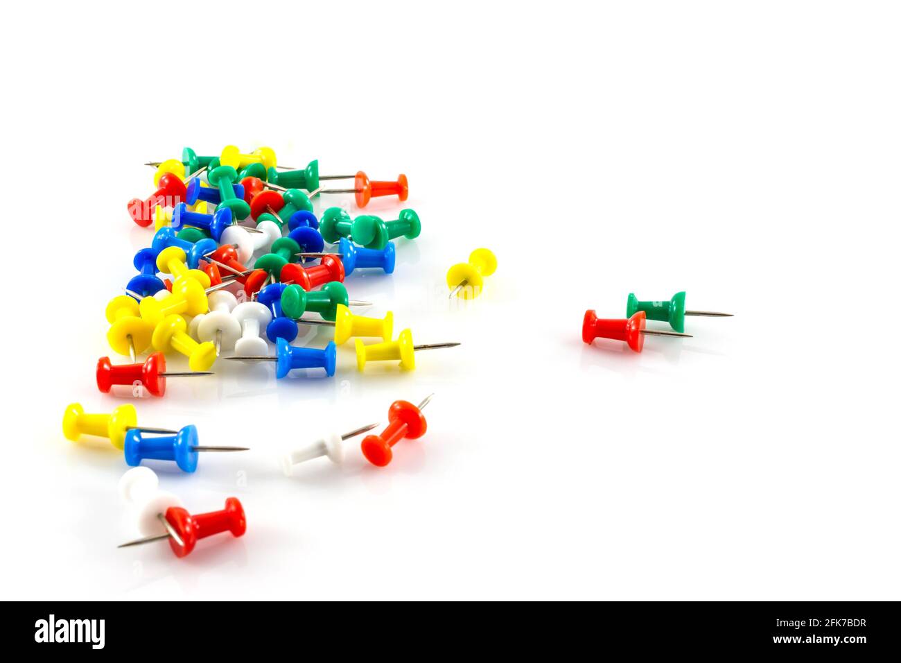 colorful push pins on white background Stock Photo - Alamy